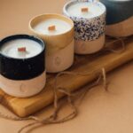 black and white candle on brown wooden holder